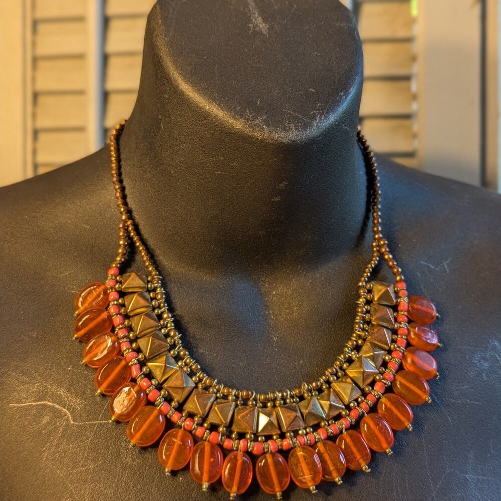 Handcrafted bronze stud bib necklace with orange glass beads